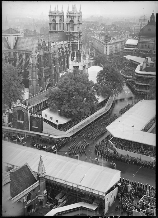 Coronation of Queen Elizabeth II, Parliament Square, City of Westminster, London, 1953. Creator: Ministry of Works. Coronation of Queen Elizabeth II, Parliament Square, City of Westminster, Greater London Authority, 02 06 1953. An elevated from the Clock Tower at the Palace of Westminster looking down towards Westminster Abbey, showing crowds of people in temporary stands, watching the coronation procession of Queen Elizabeth II.