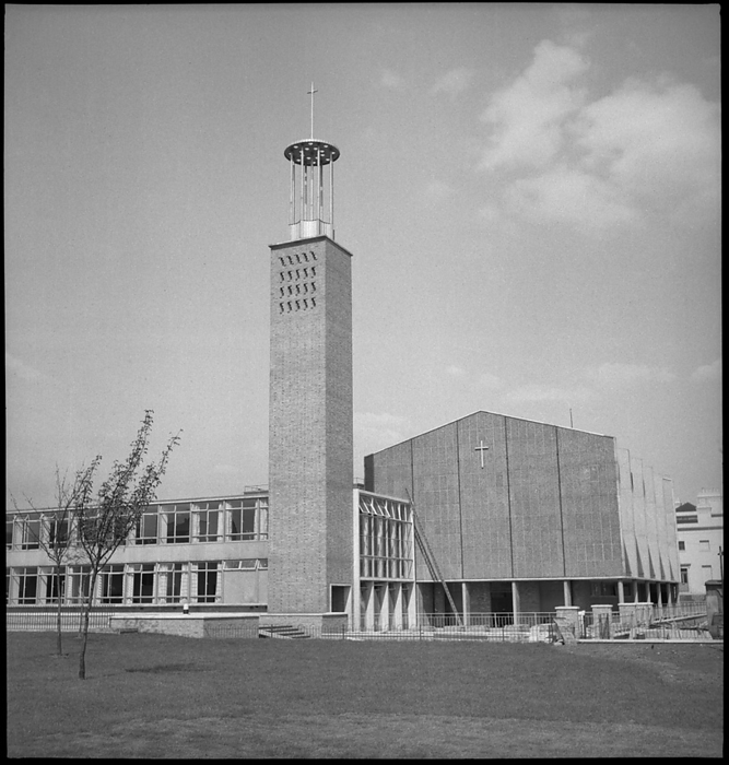 Trinity Congregational Church, East India Dock Road, Lansbury Estate, Tower Hamlets, London, 1951 Creator: Mary W Parry. Trinity Congregational Church, East India Dock Road, Lansbury Estate, Tower Hamlets, Greater London Authority, 1951. View from the west of Trinity Congregational Church and Hall, now Trinity Methodist Church. Trinity Congregational Church  later Trinity Methodist Church , was built in 1950 51 by Cecil Handisyde and D Rogers Stark. The building was part of the  Live  Architecture exhibition at the Festival of Britain in 1951.