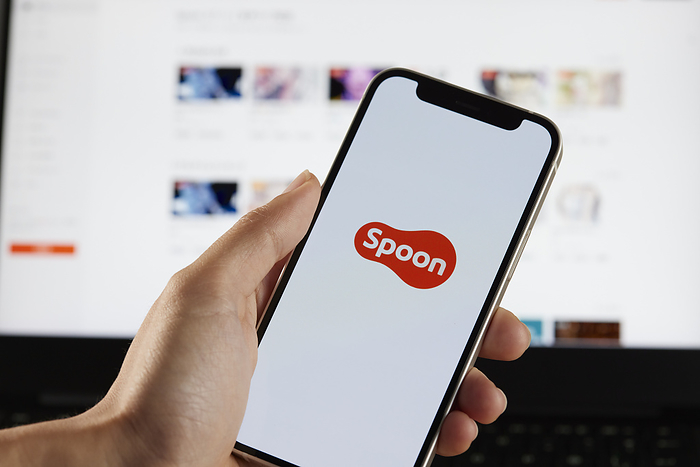 Spoon The logo of Spoon is seen on a smartphone with a computer screen in Tokyo, Japan, August 3, 2022.  Photo by Hideki Yoshihara AFLO  
