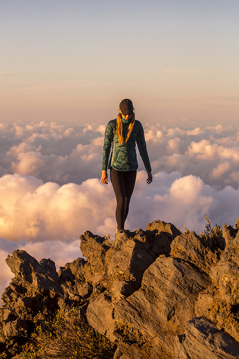 A woman high exploring the landscape above Haleakala Crater., Photo by Ben Horton / Design Pics