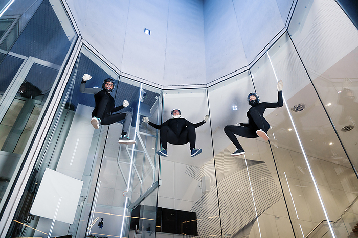 Athletes flying in wind tunnel