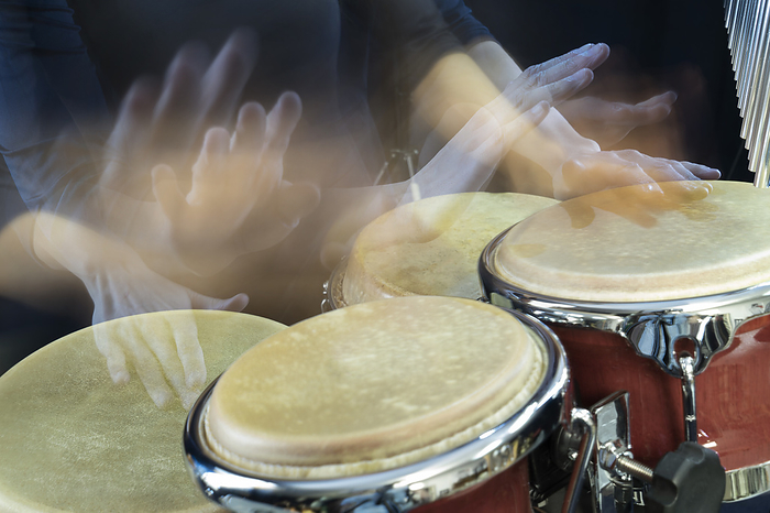 Woman playing bongos,percussion,rhythem, Hands of woman playing bongo