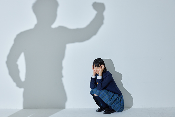 A Japanese high school girl frightened of her shadow