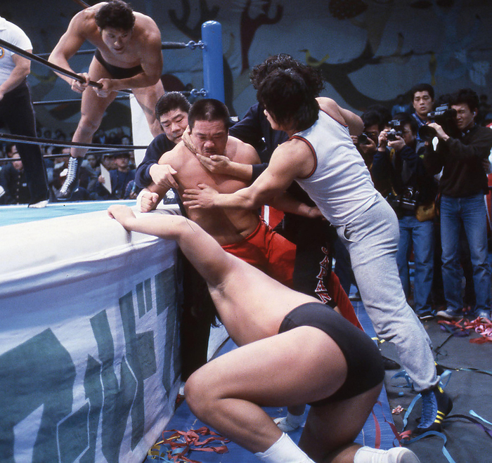 1984 New Japan Pro Wrestling March 16, 1984 New Japan Pro Wrestling Main Event Yoshiaki Fujiwara  middle  attacks Riki Choshu  bottom  after interrupting the tag team match between the regular army and the Restoration Army  top  is Antonio Inoki Kagoshima Prefectural Gymnasium