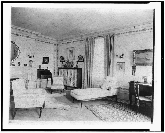 Bedroom with fireplace, padded chaise longue, window, and polar..., Greenwich, Connecticut, 1908. Creator: Frances Benjamin Johnston. Bedroom with fireplace, padded chaise longue, window, and polar bear rug, in home of Edmund Cogswell Converse, Greenwich, Connecticut, 1908. The Conyers Farm estate, designed by Donn Barber c1904, was owned by businessman Edmund C. Converse.