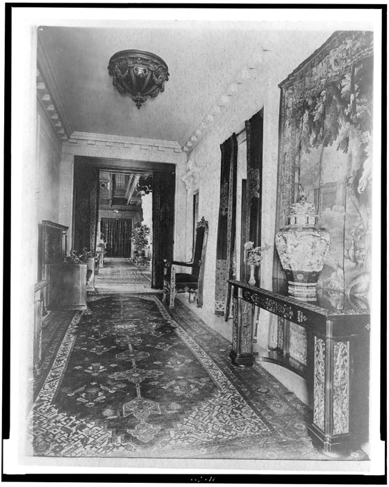 Hallway, with Oriental urn at right, in home of Edmund Cogswell... Greenwich, Connecticut, 1908. Creator: Frances Benjamin Johnston. Hallway, with Oriental urn at right, in home of Edmund Cogswell Converse, Greenwich, Connecticut, 1908. The Conyers Farm estate, designed by Donn Barber c1904, was owned by businessman Edmund C. Converse.