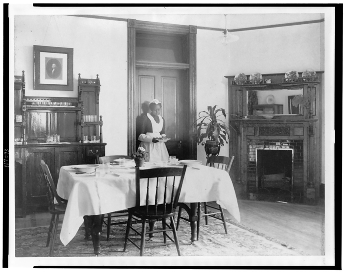 Serving the dinner, 1899 or 1900. Creator: Frances Benjamin Johnston. Serving the dinner, 1899 or 1900. Young African American woman serving dinner, Hampton Institute, Hampton, Va.