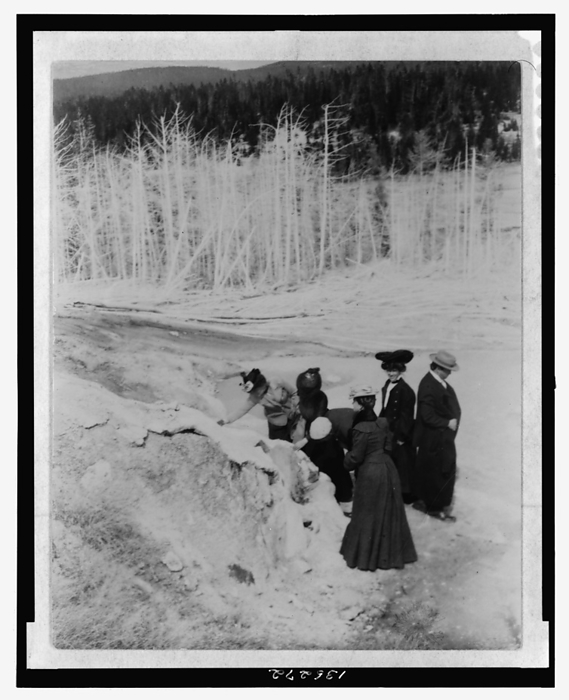 A group of tourists explore land formations in Yellowstone National Park, 1903. Creator: Frances Benjamin Johnston. A group of tourists explore land formations in Yellowstone National Park, 1903.