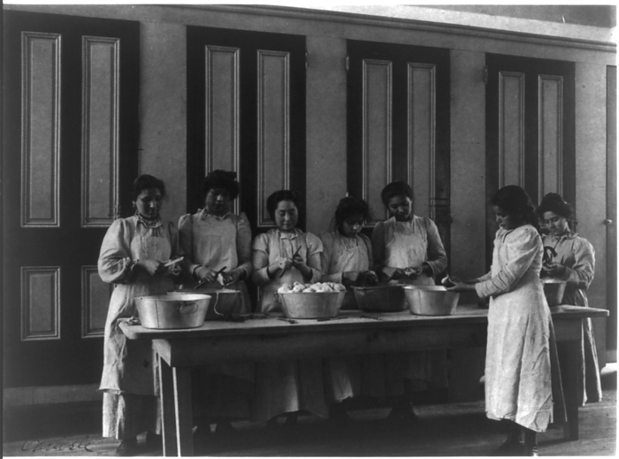 Carlisle Indian School, Carlisle, Pa. Cooking class, 1901. Creator: Frances Benjamin Johnston. Carlisle Indian School, Carlisle, Pa. Cooking class, 1901.