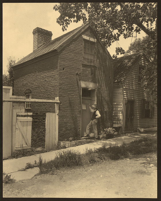 Courthouse of township Scott s Hill, Falmouth, between 1925 and 1929. Creator: Frances Benjamin Johnston. Courthouse of township Scott s Hill, Falmouth, between 1925 and 1929. Photograph shows a man standing at the door of a small brick building that serves as the courthouse for Scott s Hill, Falmouth, Virginia.