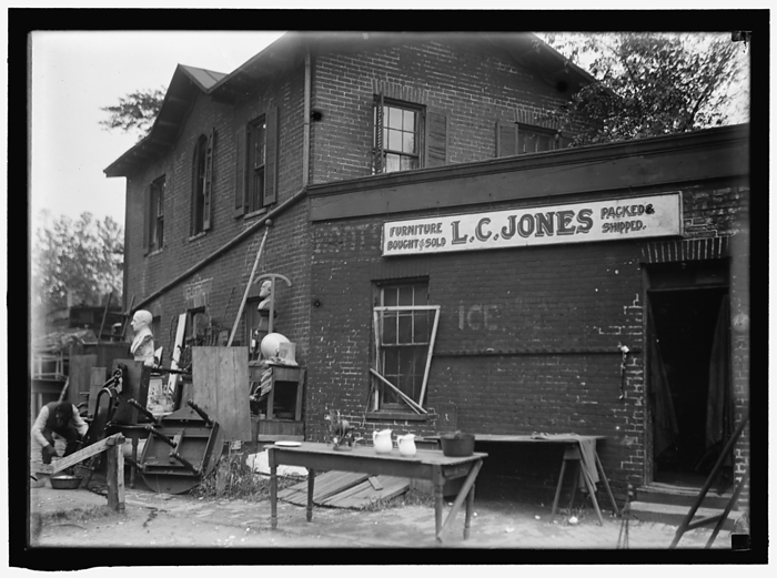 L.C. Jones Furniture, between 1911 and 1920. Creator: Harris  amp  Ewing. L.C. Jones Furniture, between 1911 and 1920. Bric a brac store, USA. Sign reads:  Furniture Bought  amp  Sold   Packed  amp  Shipped .
