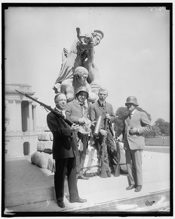 Senator Thompson  amp  German war relics, c1914 1920. Creator: Harris  amp  Ewing. Senator Thompson  amp  German war relics, c1914 1920. American politician and colleagues with war trophies posing by The Rescue sculpture, Capitol Building, Washington, D.C. The Rescue by Horatio Greenough, and another sculpture, The Discovery of America by Luigi Persico, flanked the entrance to the Capitol from the mid 19th century. They were eventually removed in 1958 as they were deemed offensive to Native Americans. The Rescue depicts a confrontation between a bellicose American Indian warrior and a pioneer family.