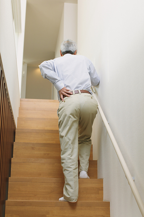 Senior Japanese man with back pain