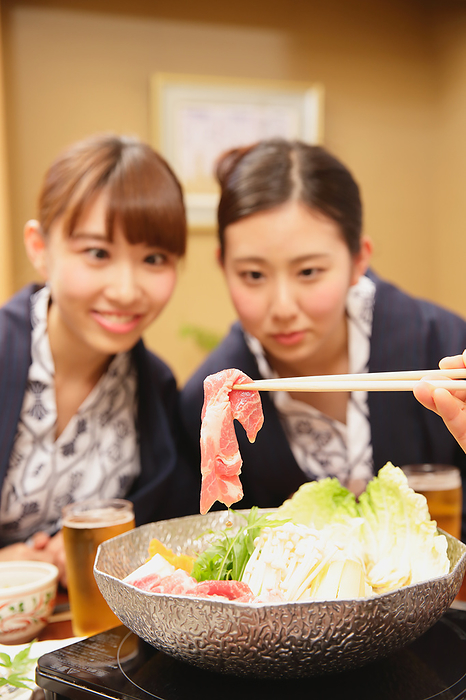 Japanese woman having dinner at an onsen ryokan