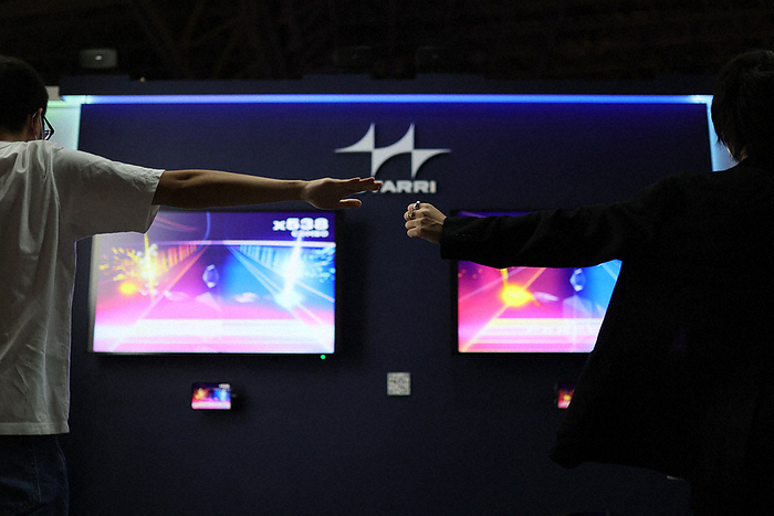 Tokyo Game Show 2022 At the Tokyo Game Show 2022, held in person for the first time in three years, people experience Nex s music game, which can be played by detecting human movement with a sensor under the screen, at Makuhari Messe in Mihama ku, Chiba City at 0:37 p.m. on September 15, 2022.