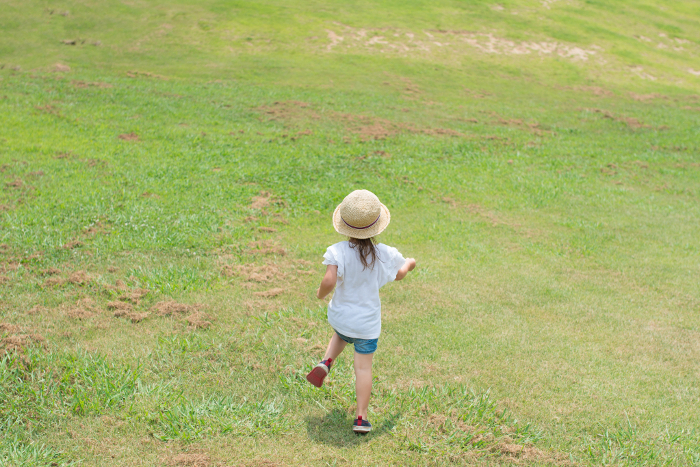 A child walking in the meadow
