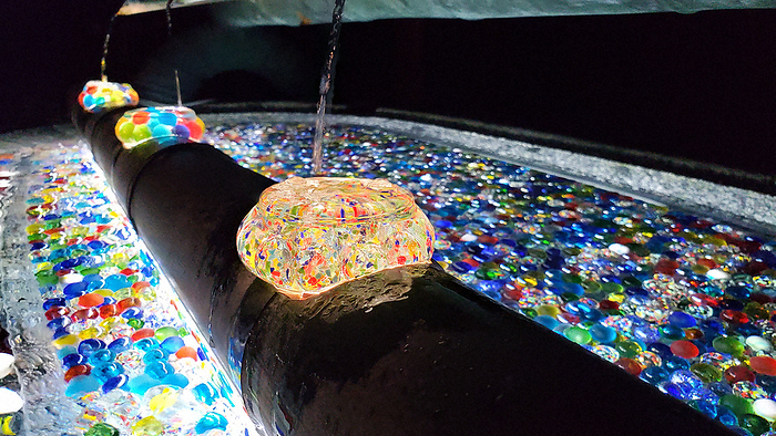 Glass beads are laid on the ground and light up the water closet fantastically. Glass beads are laid on the ground and light up the water closet. Photographed by Yo Inao at 6:43 p.m. on September 20, 2022 at Oka dera Temple in Asuka Village.