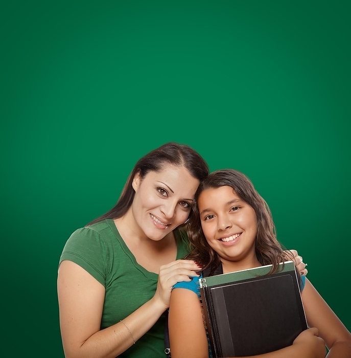 Blank chalk board behind proud hispanic mother and daughter student, Photo by Andy Dean