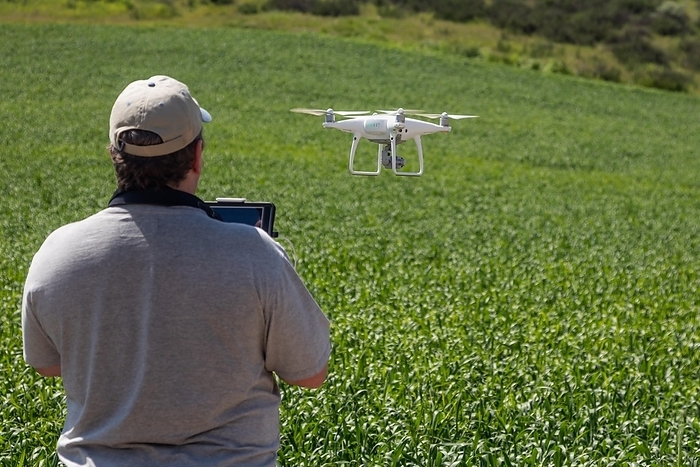UAV drone pilot flying and gathering data over country farm land, Photo by Andy Dean