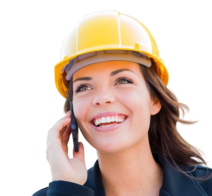 Female contractor in hard hat using cell phone isolated on white, Photo by Andy Dean