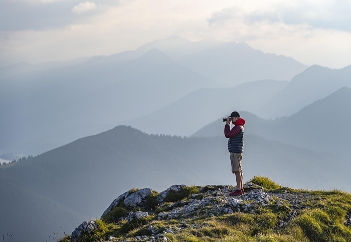 Hiker photographed on the Benediktenwand, mountains and landscape, Bavarian foothills, Benediktbeuern, Bavaria, Germany, Europe, Photo by Moritz Wolf