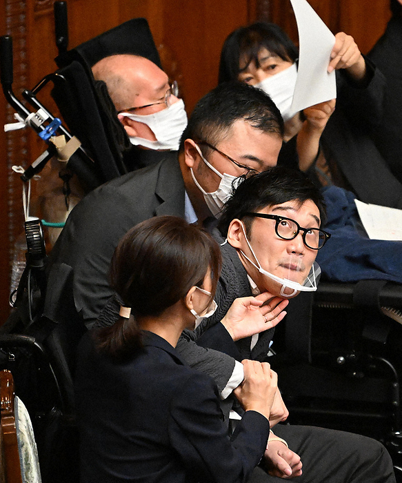 210th Extraordinary Session of the Diet, Plenary Session of the House of Councillors Daisuke Amabatake  front right , a member of the Reiwa Shinselected Group, attends a plenary session of the House of Councillors at 10:03 a.m. on October 3, 2022, in the National Diet.