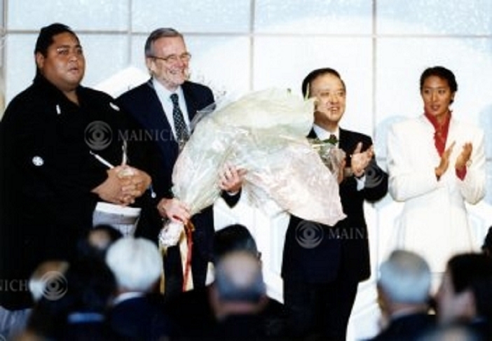 Former Prime Minister Toshiki Kaifu Treasury Secretary Brady receives a bouquet of flowers at a luncheon hosted by the welcoming committee. Treasury Secretary Brady receives a bouquet of flowers from Ms. Mikako Kotani  right  and Mr. Ko Nishiki  left  at a luncheon hosted by the welcoming committee. Former Prime Minister Kaifu  right  at the Akasaka Prince Hotel on Jan. 09, 1992.