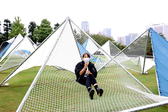 An annual design event Tokyo Midtown Design Touch starts October 14, 2022, Tokyo, Japan   Japanese architect Yuko Nagayama displays a large installation  Sea Hammock  which is formed by tarps and fishnets on the lawn field as a part of the  Tokyo Midtown Design Touch 2022  in Tokyo on Friday, October 14, 2022. An annual design event with the theme of  Design for Sustainable Future  started at the Tokyo Midtown through November 3.       Photo by Yoshio Tsunoda AFLO 