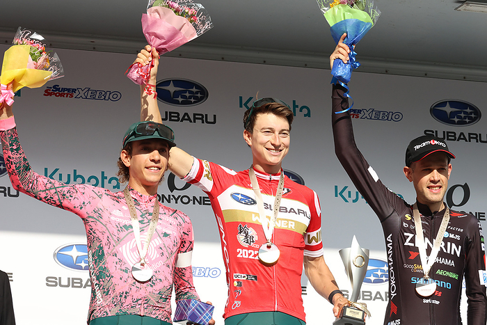 2022 Japan Cup Cycle Road Race October 16, 2022, Utsunomiya, Japan    L R  Italian cyclist Andrea Piccolo of EF Education Easypost, American cyclist Neilson Powless of EF Education Easypost and Australian Benjamin Dyball of Team Ukyo raise flower bouquets as they won the Japan Cup Cycle Roadrace in Utsunomiya, 100km north of Tokyo on Sunday, October 16, 2022. Powless won the race while his teammate Piccolo finished the second and Dyball finished the third.       Photo by Yoshio Tsunoda AFLO  