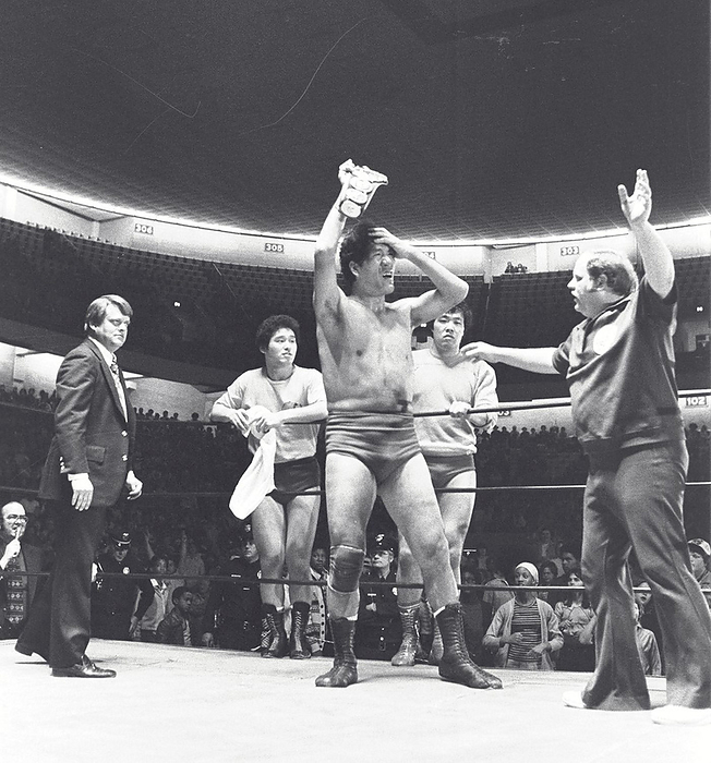 1977 All Japan Pro Wrestling March 20, 1977, defeating Baron von Racik Giant Baba is elated after making his 34th consecutive title defense in enemy territory. Behind him are Genichiro Tenryu and Jumbo Tsuruta. On the left is Jim Crockett Jr. at the Greensboro Coliseum.