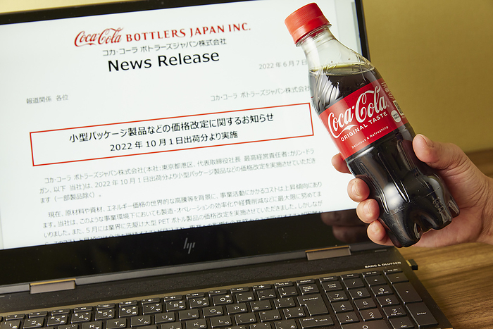 Bottle of Coca Cola Bottle of Coca Cola in front of Coca Cola Bottlers Japan Inc. s website in Tokyo, Japan, October 13, 2022. The website s news release announced that their products will be increasing in price. Photo by Hideki Yoshihara AFLO 