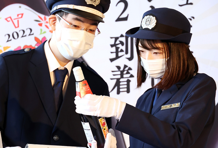 The first shipment of 2022 vintage Beaujolais Nouveau arrives at Haneda airport October 19, 2022, Tokyo, Japan   Custom officers check a bottle of 2022 vintage Beaujolais Nouveau wine after the first shipment of the wine arrived at the Haneda airport in Tokyo on Wednesday, October 19, 2022. The first shipment of 3,192 bottles of the 2022 vintage wine arrived as the wine s embargo will be removed on November 17.       Photo by Yoshio Tsunoda AFLO 