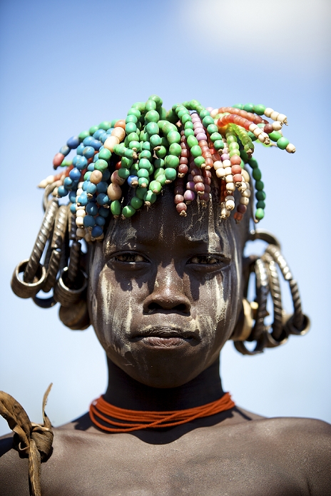 People of the World Ethiopia The mark of the Mursi people is a plate on their lips  2010  Children from the Mursi tribe in South Ethiopia,paint their faces with a white clay and wear many beads.Omo Valley,Ethiopia,2010