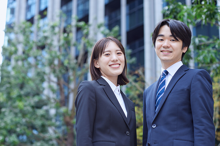 Smiling Japanese business men and women
