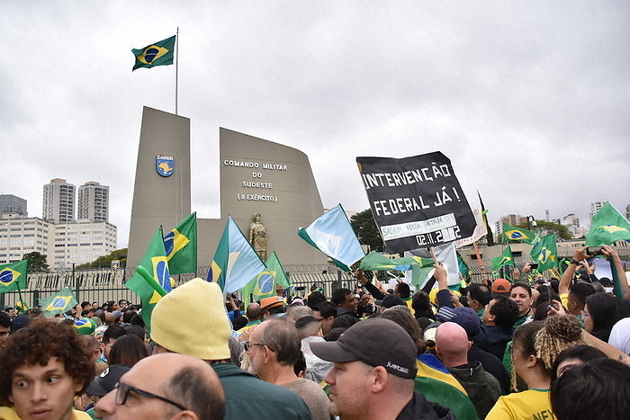 2022 Brazilian Presidential Election Protests over Bolsonaro s Defeat Federal Government Intervene Now   urging the military to intervene in the election results. supporters of President Bolsonaro fill the front of a military facility while holding up a message that urges the military to intervene in the election results, in Sao Paulo, November 2, 2022.