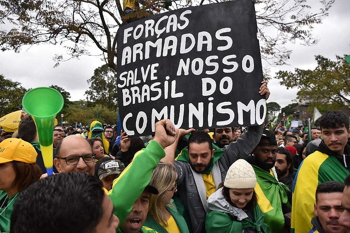 2022 Brazilian Presidential Election Protests over Bolsonaro s Defeat A man who considers former President Lula, who won the presidential runoff election, a communist and holds up a message saying  The military must defend the country against communism  in Sao Paulo, November 2, 2022.