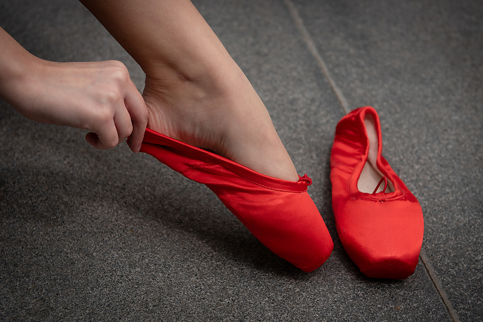 Ballerina dancer wearing red pallet pointe slippers Ballerina dancer wearing red pallet pointe slippers