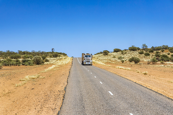 On the Lasseter Highway towards Uluru in the Australian outback in the red center