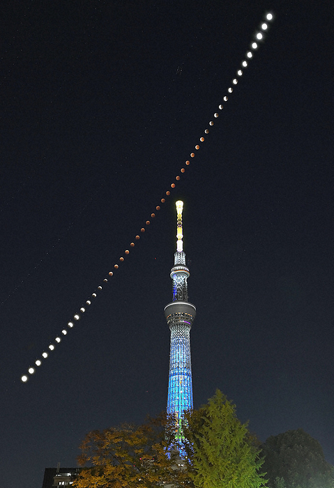 Total lunar eclipse observed in various parts of Japan The entire progression from partial to total lunar eclipse behind the Tokyo Sky Tree, photographed by Koichiro Tezuka on November 8, 2022 in Sumida ku, Tokyo  comparison and brightness composite of 48 images taken from 6:05 PM to 9:55 PM at 5 minute intervals .