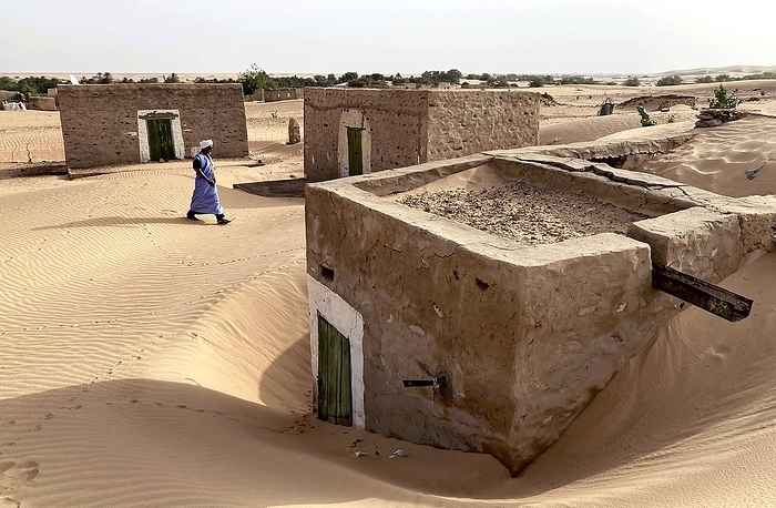 House buried in sand as desert continues to expand in Singeti, Central Mauritania. A house buried in sand as the desert continues to expand. In Singhetti, central Mauritania. published in the morning edition of August 24, 2022,  World Heritage Sinking into the Sahara: Global Warming from TICAD 27th, The Bill for Western Emissions .