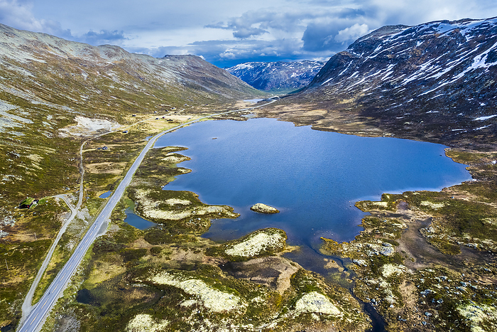 Norway Norway, Viken, Drone view of road stretching past lake in Hemsedalfjell range, Photo by Stefan Schurr