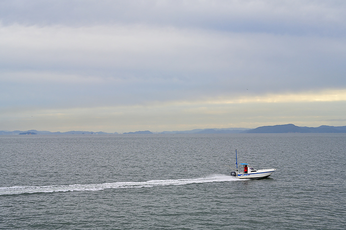 Remote islands and small fishing boats in the Seto Inland Sea Okayama Prefecture cirrostratus cloud