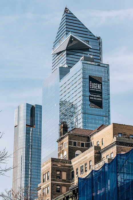A view of 30 Hudson Yards through apartment buildings in Chelsea New York City A view of 30 Hudson Yards through apartment buildings in Chelsea New York City