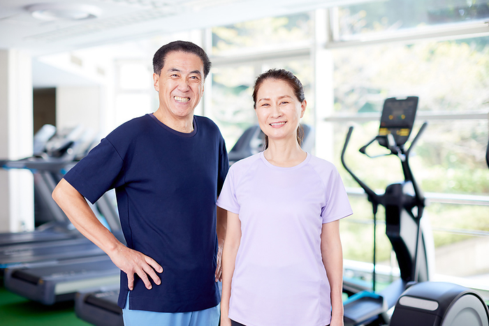 Portrait of a Japanese senior couple at the gym