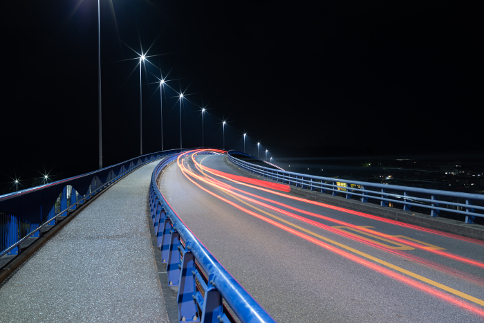 Bridge and car light trail at night