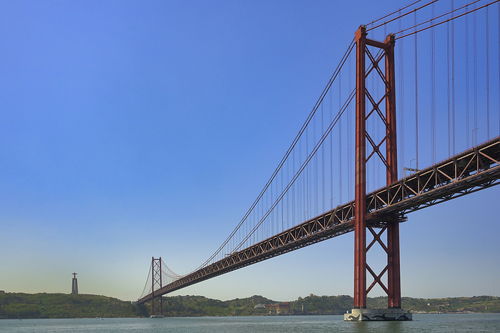 25 April suspension bridge over the Tagus river and Almada Christ, Lisbon, Portugal 25 April suspension bridge over the Tagus River and Almada Christ, Lisbon, Portugal, Europe, Photo by G M Therin Weise