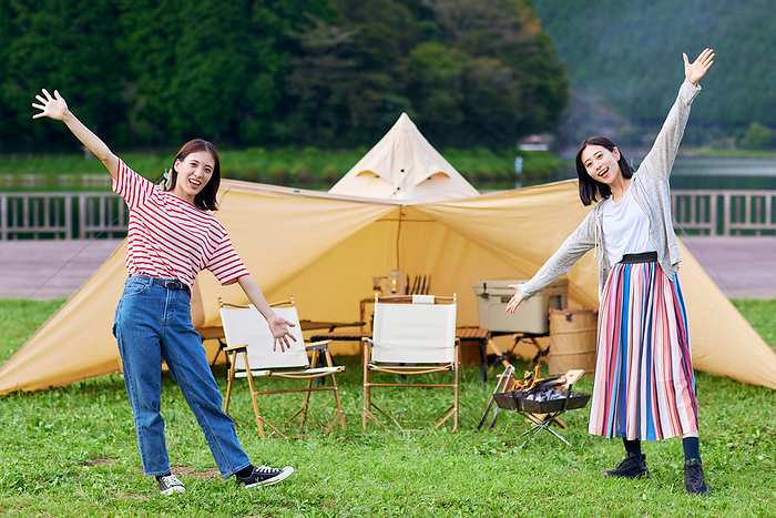 Young Japanese women enjoying camping