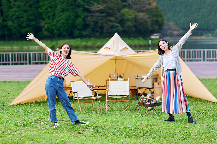 Young Japanese women enjoying camping