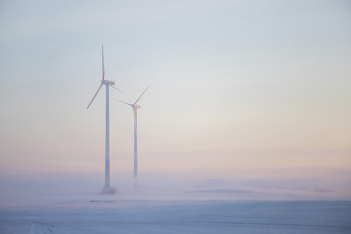 Wind turbine in fog, Photo by Aron Kühne
