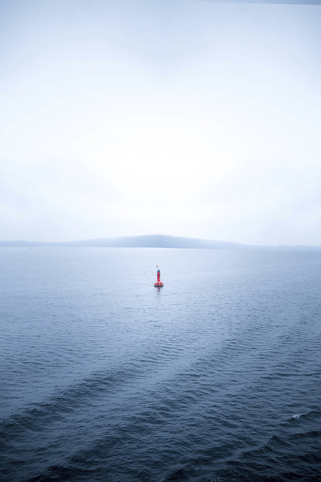 Buoy in the sea, solitude, Photo by Aron Kühne